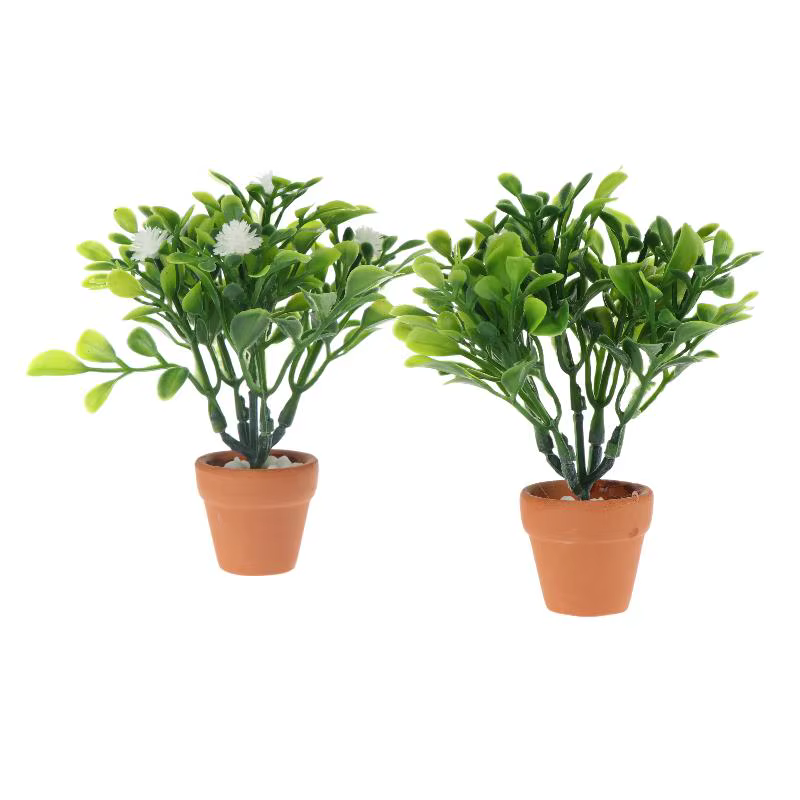 Miniature de fleur blanche et de plante verte en pot