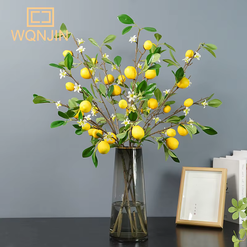 Branche de fruits de citron de luxe avec feuilles vertes