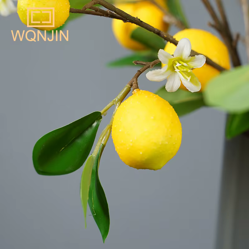 Branche de fruits de citron de luxe avec feuilles vertes