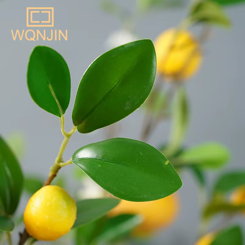 Branche de fruits de citron de luxe avec feuilles vertes