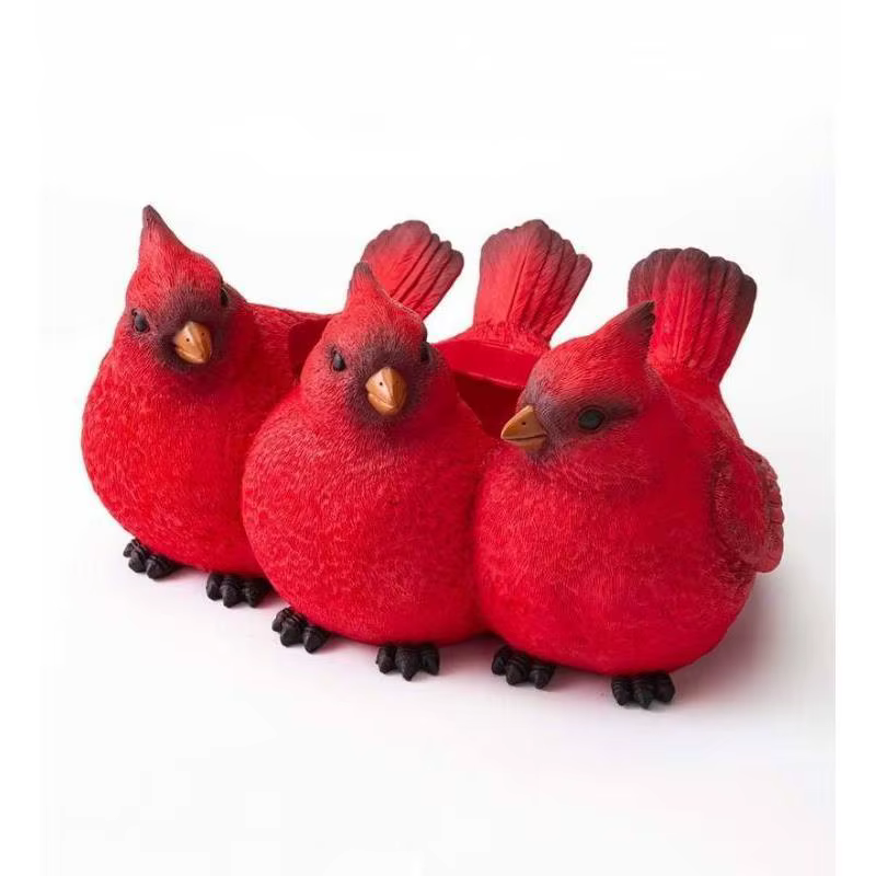 Pot de fleur à trois oiseaux rouge de dessin animé