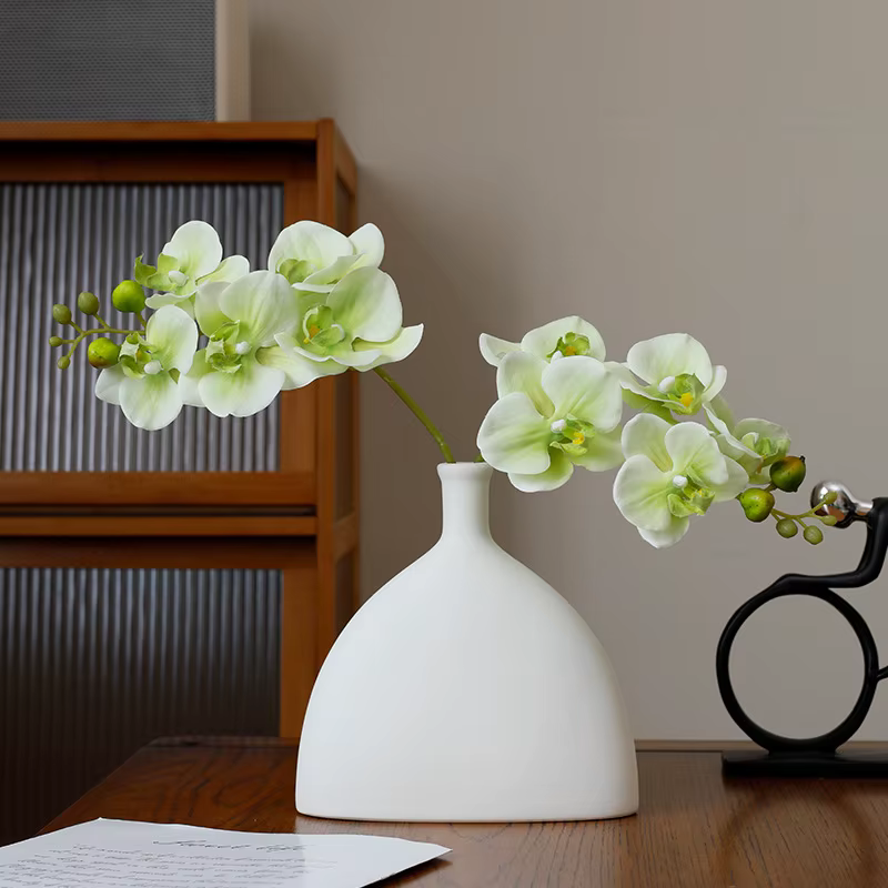 Orchidée papillon au toucher réel