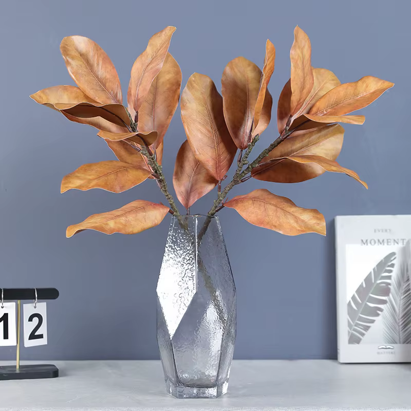 Plantes artificielles en feuilles de magnolia simulées