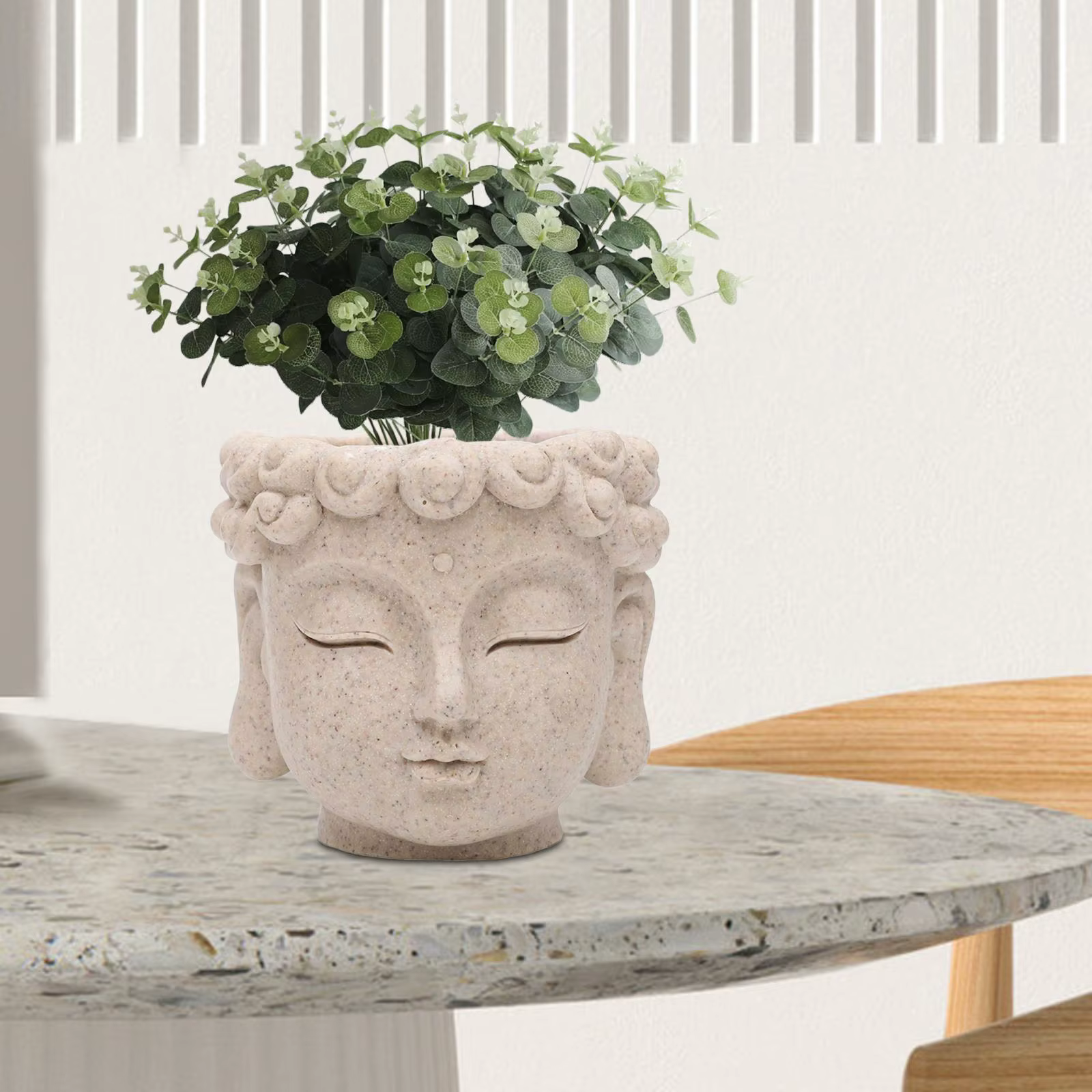 Pot de fleurs en forme de tête de Bouddha