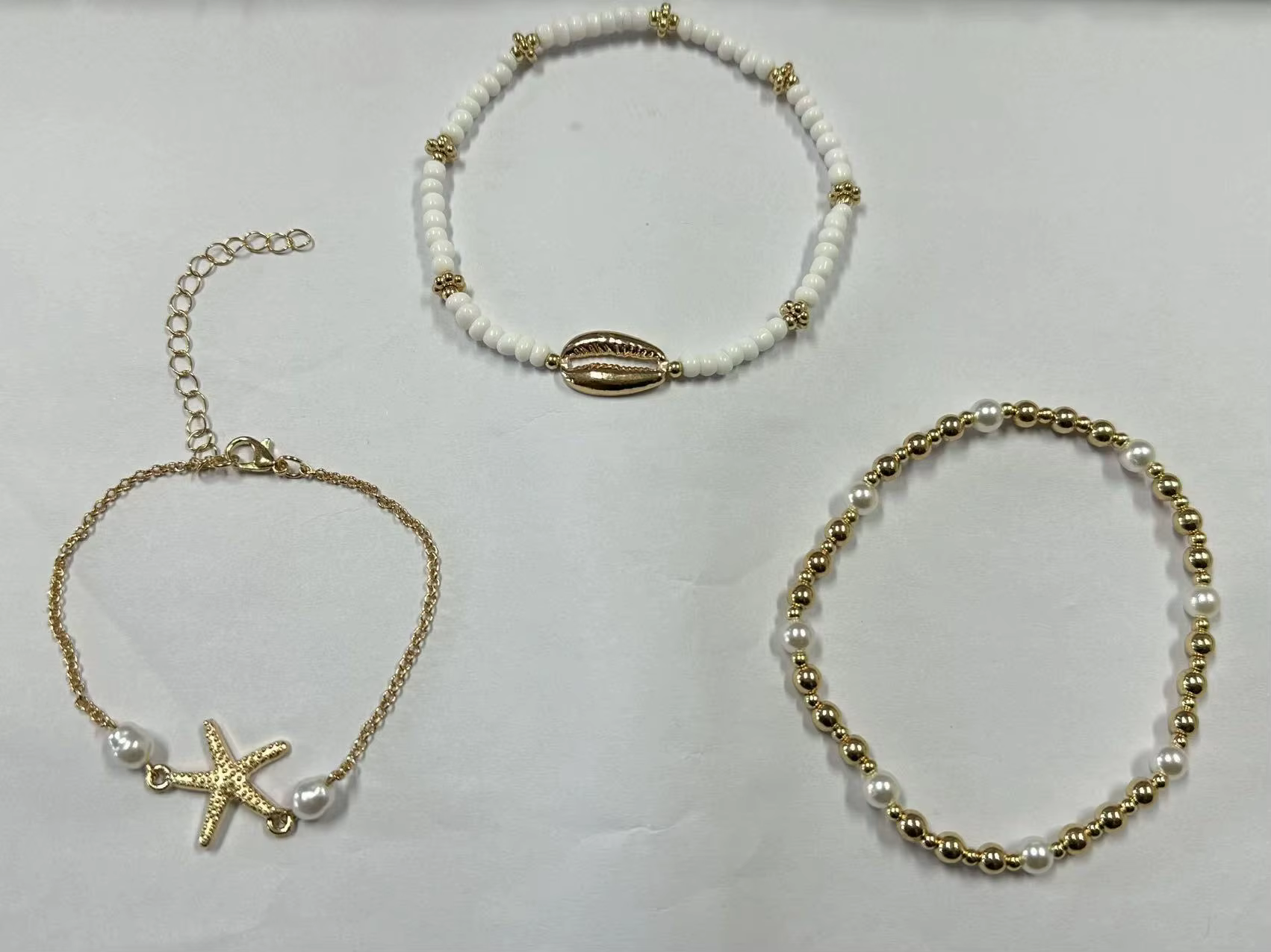 Chaînes de cheville de Style bohème pour femmes, accessoires de pied à trois couches avec perles de riz, coquillages et étoile de mer