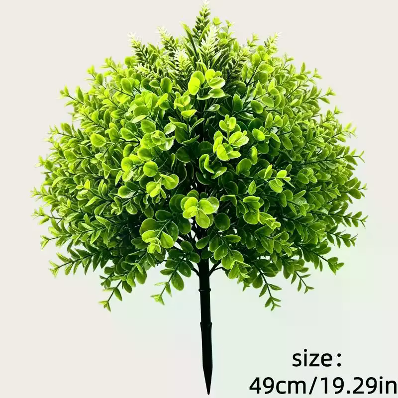 Plantes vertes artificielles sur piquet