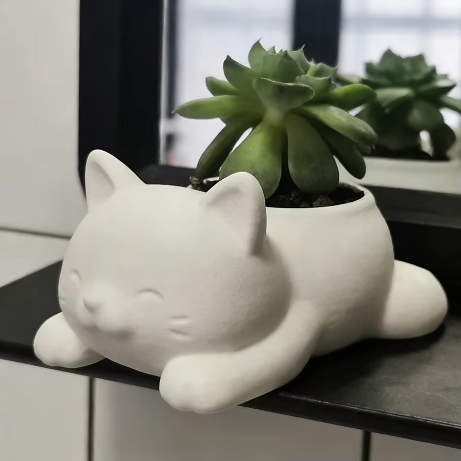 1 pot de fleurs en forme de chat couché de style dessin animé