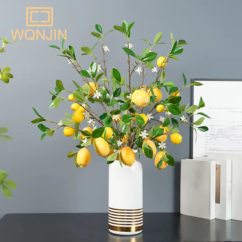 Branche de fruits de citron de luxe avec feuilles vertes