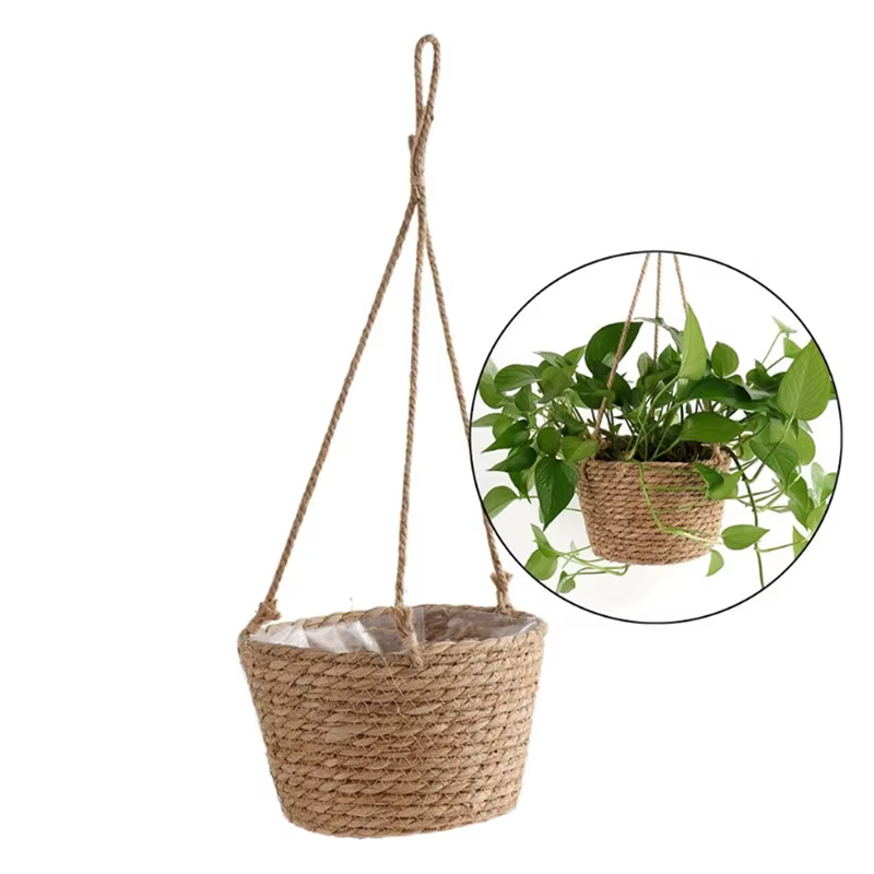 Paniers de fleurs suspendus tissés en herbe