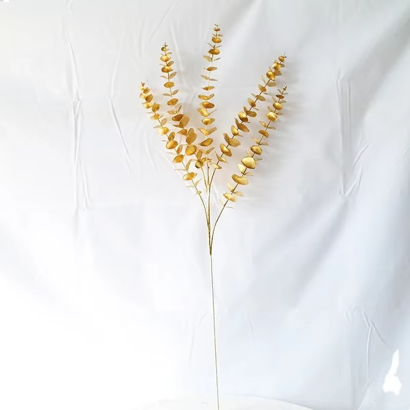Plantes artificielles dorées chaudes