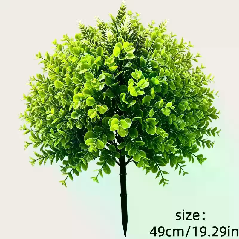 Plantes vertes artificielles sur piquet