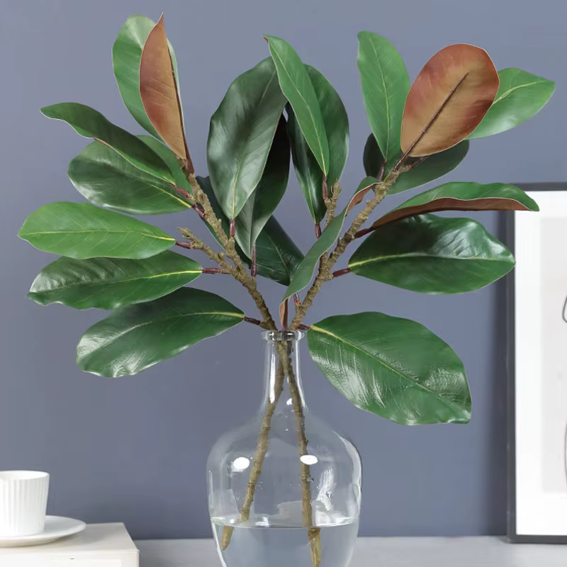 Plantes artificielles en feuilles de magnolia simulées