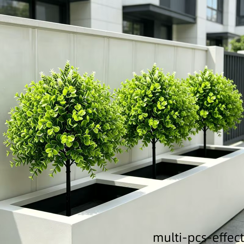 Plantes vertes artificielles sur piquet