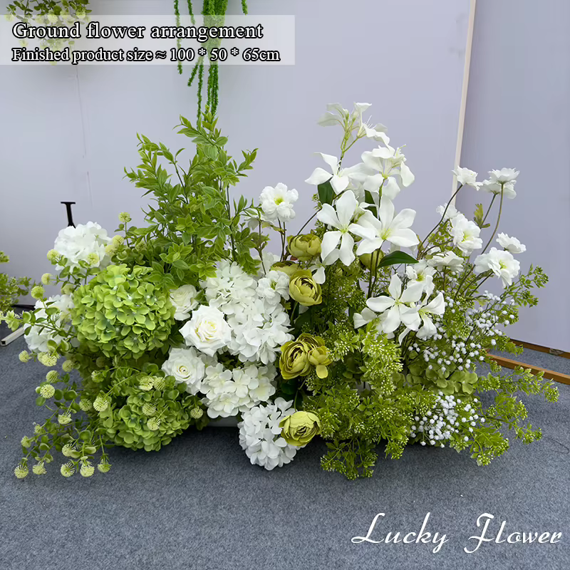 Décoration de mariage avec fleurs artificielles blanches et vertes