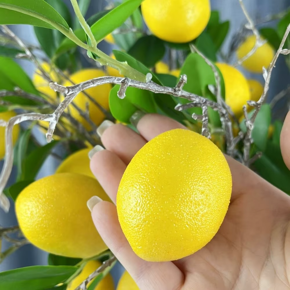 Feuilles vertes, branche de citron artificielle