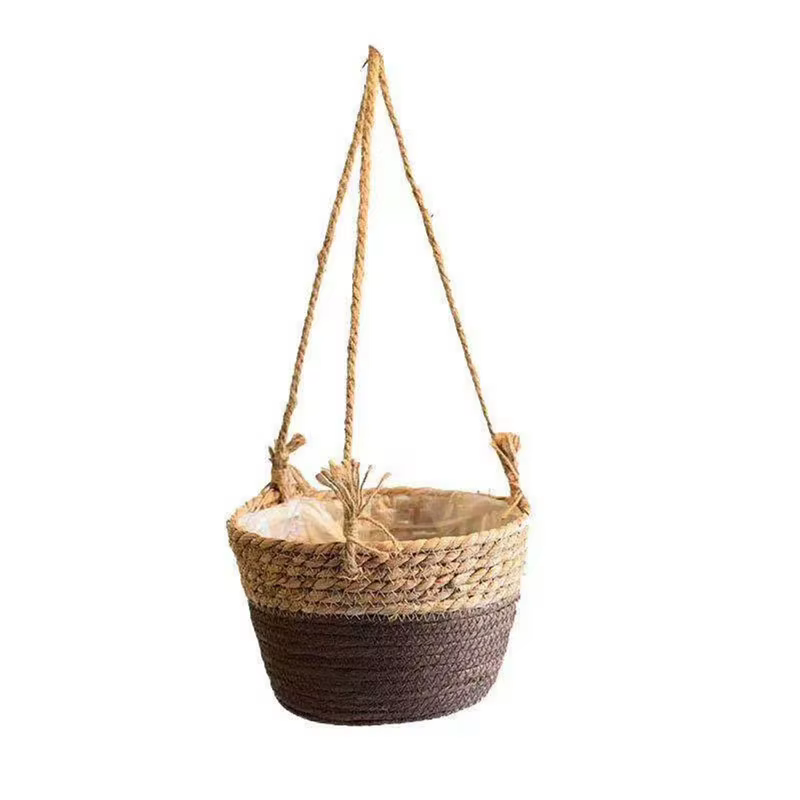Paniers de fleurs suspendus tissés en herbe