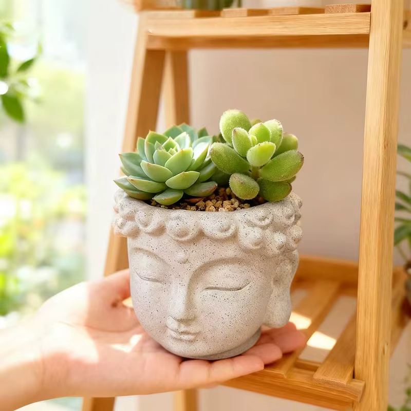 Pot de fleurs en forme de visage de Bouddha