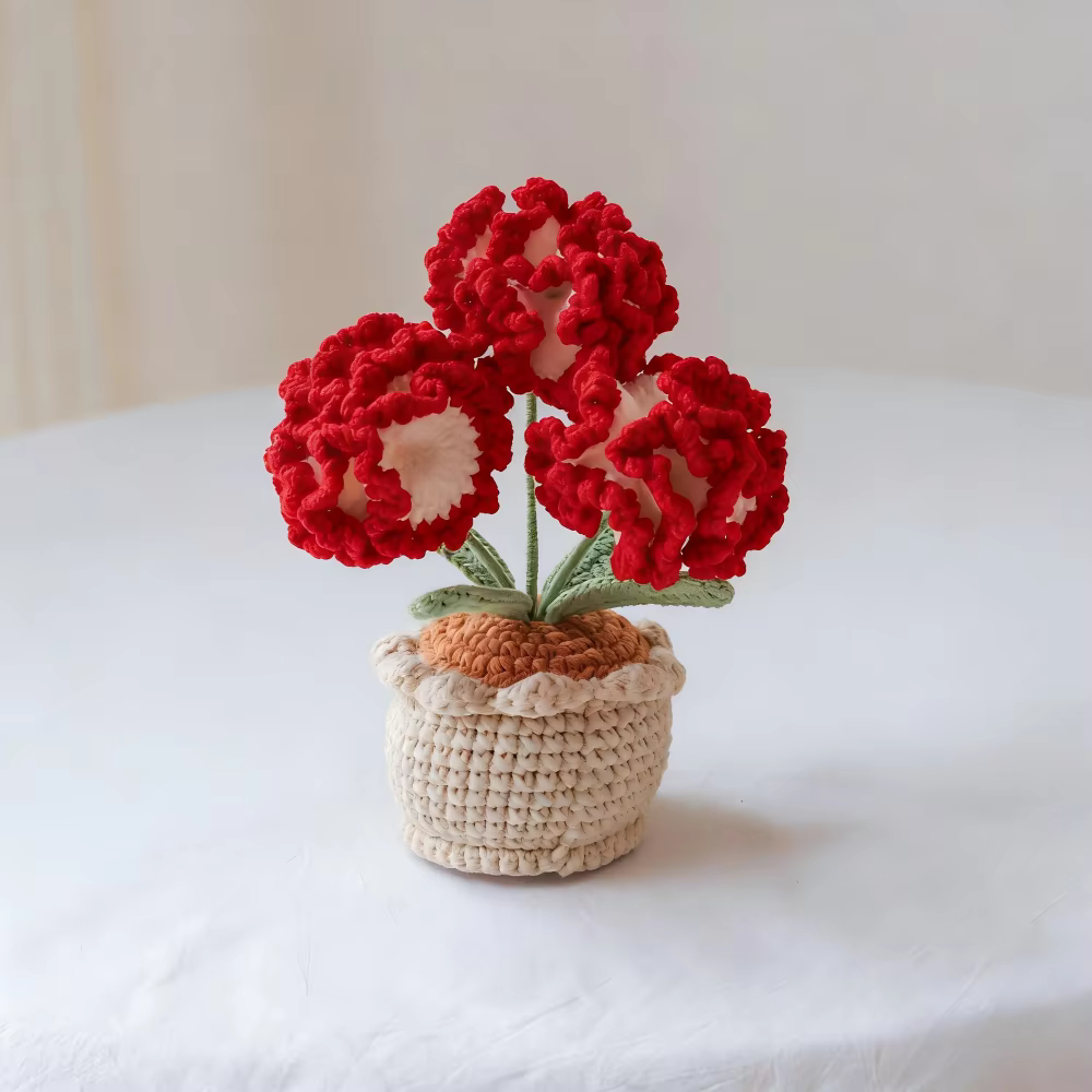 Plante en pot de carnations en laine crochetée à la main