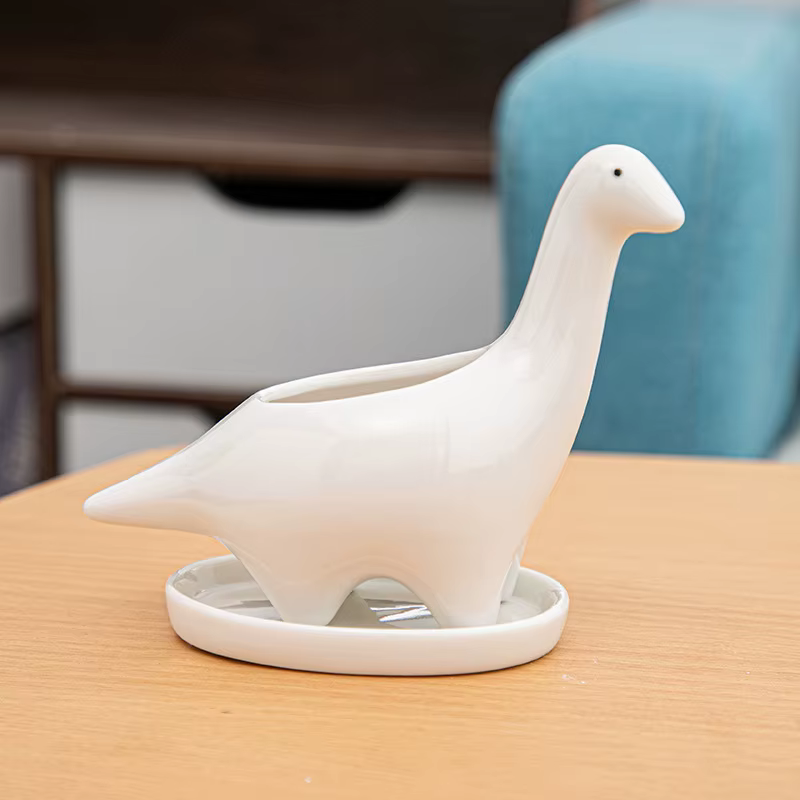 Pot de fleur de dinosaure en céramique blanche